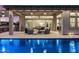 Covered patio overlooking a sparkling pool and lush backyard, perfect for outdoor entertaining at 9445 W Monte Lindo --, Peoria, AZ 85383