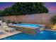 Relaxing backyard spa with a soothing waterfall feature, surrounded by lush landscaping at 9445 W Monte Lindo --, Peoria, AZ 85383