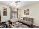 Cozy bedroom featuring a futon, window, and carpet, perfect for relaxation at 9501 E Broadway Rd # 168, Mesa, AZ 85208