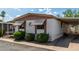 Charming exterior featuring white siding, awning-covered windows, and well-maintained landscaping at 9501 E Broadway Rd # 168, Mesa, AZ 85208