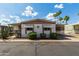 This beautiful home features awnings, landscaping, and a covered parking area at 9501 E Broadway Rd # 168, Mesa, AZ 85208