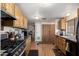 Bright kitchen featuring wood cabinetry, a gas range and plenty of counter space at 9501 E Broadway Rd # 168, Mesa, AZ 85208