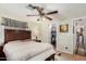 Bedroom with a ceiling fan and ensuite bathroom with a closet at 9501 E Broadway Rd # 168, Mesa, AZ 85208