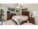 Bedroom with ceiling fan, dresser, and a window with curtains at 9501 E Broadway Rd # 168, Mesa, AZ 85208