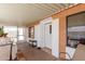 Covered patio offers an outdoor living space, with a table, seating and view to the community at 9501 E Broadway Rd # 168, Mesa, AZ 85208