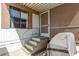 Inviting covered porch with secure door, exterior window, and convenient access steps at 9501 E Broadway Rd # 168, Mesa, AZ 85208