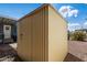 This is an exterior shot of a metal storage shed, conveniently located on the property's grounds at 9501 E Broadway Rd # 168, Mesa, AZ 85208