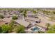 Well-maintained home with a private backyard featuring a sparkling pool and lush landscaping at 10261 W Foothill Dr, Peoria, AZ 85383