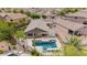 Aerial view of a well-maintained home with a private backyard, pool, and covered outdoor kitchen at 10261 W Foothill Dr, Peoria, AZ 85383