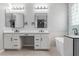 Bright bathroom featuring dual sinks, and a shower and tub at 10261 W Foothill Dr, Peoria, AZ 85383