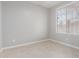 Bedroom featuring a window and beige tile floors at 10261 W Foothill Dr, Peoria, AZ 85383