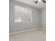 Bedroom with a window and beige tile floors at 10261 W Foothill Dr, Peoria, AZ 85383