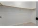 Walk-in closet with wooden shelves, offering ample storage space at 10261 W Foothill Dr, Peoria, AZ 85383