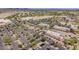 Aerial view of a commercial area with stores, parking lots, and roads, showcasing retail and services in the neighborhood at 10261 W Foothill Dr, Peoria, AZ 85383