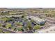Aerial view of a shopping complex, roads, and parking areas surrounded by scenic mountains, showcasing the location and accessibility at 10261 W Foothill Dr, Peoria, AZ 85383