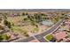 Aerial view of a neighborhood park featuring walking trails, grassy areas and desert landscape at 10261 W Foothill Dr, Peoria, AZ 85383