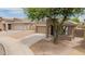 Well-maintained single Gathering home with neutral paint, desert landscaping, and shade tree at 10261 W Foothill Dr, Peoria, AZ 85383