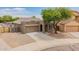 Charming single-Gathering home with a well-manicured front yard and a two car garage at 10261 W Foothill Dr, Peoria, AZ 85383