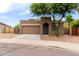 Charming single-story home featuring a two-car garage and desert landscaping at 10261 W Foothill Dr, Peoria, AZ 85383
