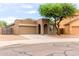 Well-maintained home with a two-car garage, showcasing its desert-style landscaping at 10261 W Foothill Dr, Peoria, AZ 85383