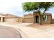 Street view of a well-kept home, featuring desert landscaping and a two-car garage at 10261 W Foothill Dr, Peoria, AZ 85383