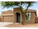 Charming front view showing the unique architectural details and desert landscaping at 10261 W Foothill Dr, Peoria, AZ 85383