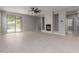 Bright living area with tile floors, fireplace, and sliding glass doors to the patio at 10261 W Foothill Dr, Peoria, AZ 85383