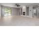 Spacious living room with modern fireplace and sliding glass doors to outdoor pool at 10261 W Foothill Dr, Peoria, AZ 85383