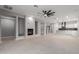 Open-concept living room with sleek fireplace and modern ceiling fan at 10261 W Foothill Dr, Peoria, AZ 85383