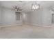 Bright living room with tile flooring, contemporary lighting, and open layout at 10261 W Foothill Dr, Peoria, AZ 85383