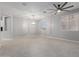 Open-concept living room featuring tile floors, recessed lighting, and ample natural light at 10261 W Foothill Dr, Peoria, AZ 85383