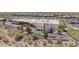 Aerial view of a shopping center featuring stores, a movie theater, ample parking, and landscaping in a commercial area at 10261 W Foothill Dr, Peoria, AZ 85383