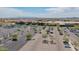 Aerial image highlights a shopping center's extensive parking, retail buildings, and overall commercial landscape on a sunny day at 10261 W Foothill Dr, Peoria, AZ 85383