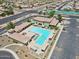 Aerial view of the Sunland Springs pool area featuring lounge chairs, swimming pool, and desert landscaping at 11320 E Newcastle Ave, Mesa, AZ 85209