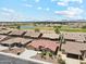 Picturesque aerial view of a lovely community complete with lakes and desert landscaping at 11320 E Newcastle Ave, Mesa, AZ 85209