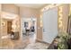 Welcoming foyer featuring tile flooring, decorative lighting, and an arched entryway to the office at 11320 E Newcastle Ave, Mesa, AZ 85209