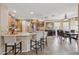 Open kitchen features granite countertops, stainless steel appliances, and a breakfast bar with seating at 11320 E Newcastle Ave, Mesa, AZ 85209
