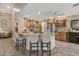 Beautiful kitchen with granite counters, breakfast bar seating, stainless appliances, and ample wooden cabinetry at 11320 E Newcastle Ave, Mesa, AZ 85209