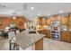 Well-equipped kitchen with breakfast bar that opens up to the living room for seamless entertaining at 11320 E Newcastle Ave, Mesa, AZ 85209