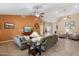 Inviting living room featuring neutral colors, vaulted ceilings, and a seamless transition to other living spaces at 11320 E Newcastle Ave, Mesa, AZ 85209