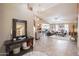 Spacious living room with an open floor plan, tile flooring, and a neutral color palette at 11320 E Newcastle Ave, Mesa, AZ 85209