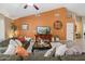 Cozy living room showcasing a vaulted ceiling, modern decor, and a large window with natural light at 11320 E Newcastle Ave, Mesa, AZ 85209
