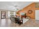 Comfortable living room with a vaulted ceiling, ample seating, and access to the outdoor patio at 11320 E Newcastle Ave, Mesa, AZ 85209