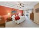 Bright main bedroom with a tray ceiling, en-suite bath access, and an attached private patio at 11320 E Newcastle Ave, Mesa, AZ 85209