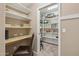 Well-organized walk-in pantry featuring a convenient desk area and an abundance of shelving at 11320 E Newcastle Ave, Mesa, AZ 85209