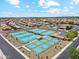 Aerial view showcasing the tennis courts and community spaces within the Sunland Springs residential area at 11320 E Newcastle Ave, Mesa, AZ 85209