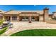 Beautiful backyard with patio, outdoor seating, built-in grill and grass at 14058 S 24Th Way, Phoenix, AZ 85048