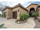 Charming home exterior featuring multiple garage doors and inviting desert landscaping at 14058 S 24Th Way, Phoenix, AZ 85048