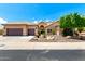 Charming single-story home with a tile roof, desert landscaping, and an attached three-car garage at 14058 S 24Th Way, Phoenix, AZ 85048
