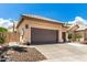 Charming home featuring a two-car garage with mature desert landscaping and a beautiful blue sky at 14058 S 24Th Way, Phoenix, AZ 85048